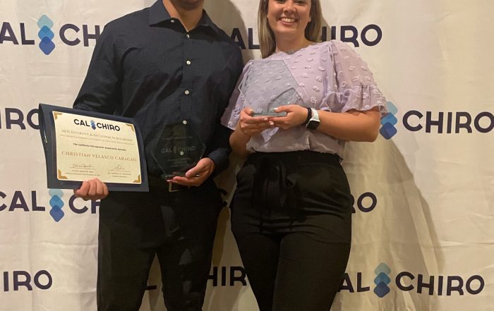 A photo of Christian Caragao and Katie Sakamoto posing with their awards from CalChiro