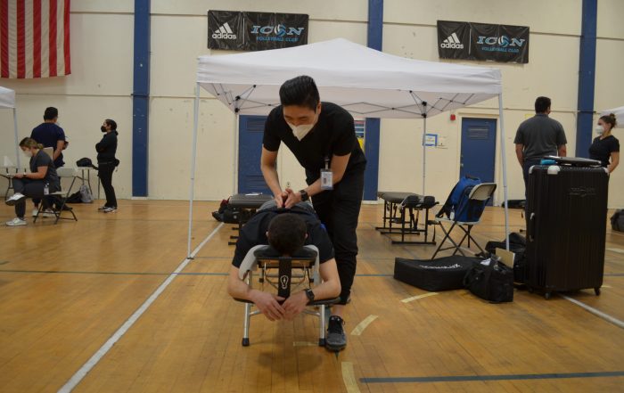 A photo of a patient receiving treatment at the SCU Health Tent Event