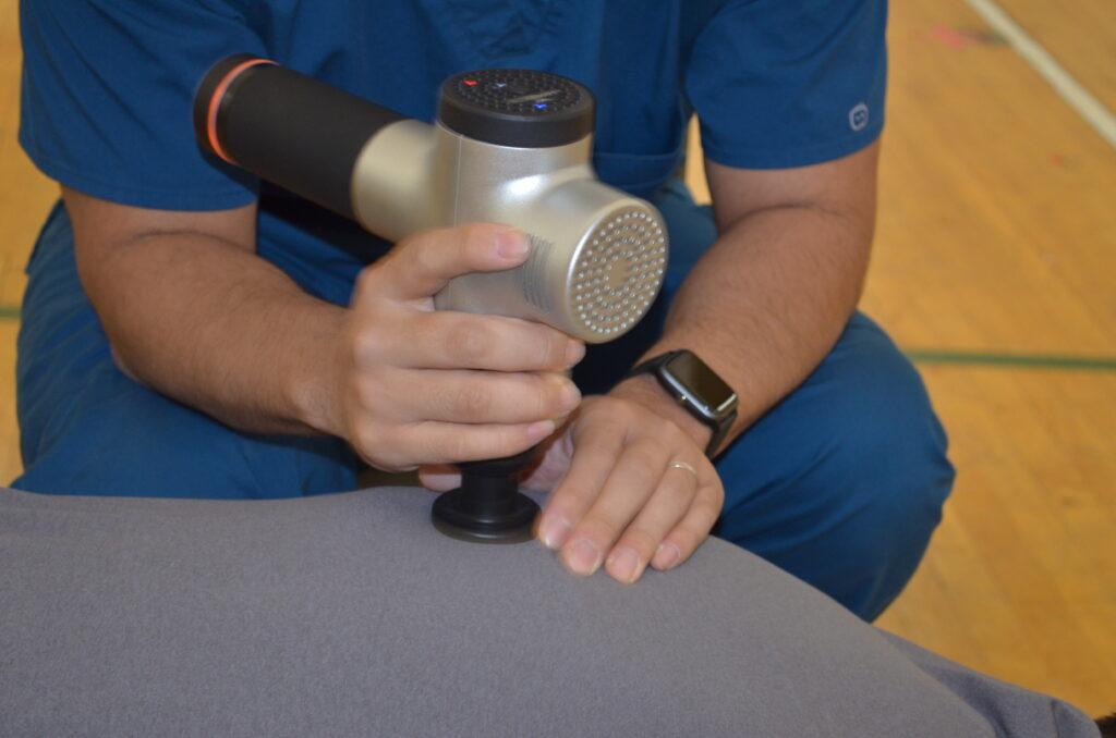 An unidentified patient receives a chiropractic adjustment at a Tent Event free outreach clinic, hosted by SCU Health.