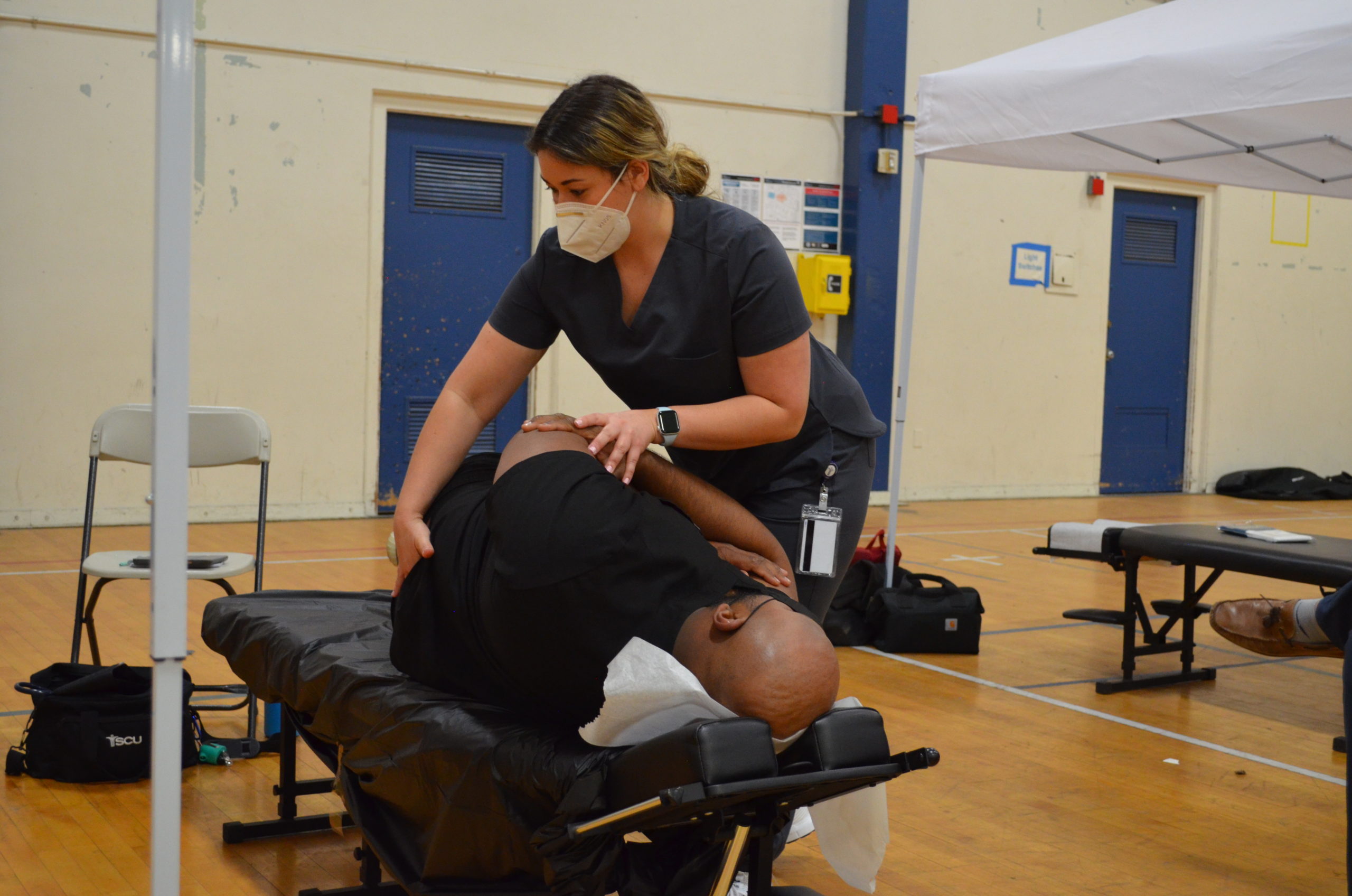 A photo of a patient receiving treatment at the SCU Health Tent Event