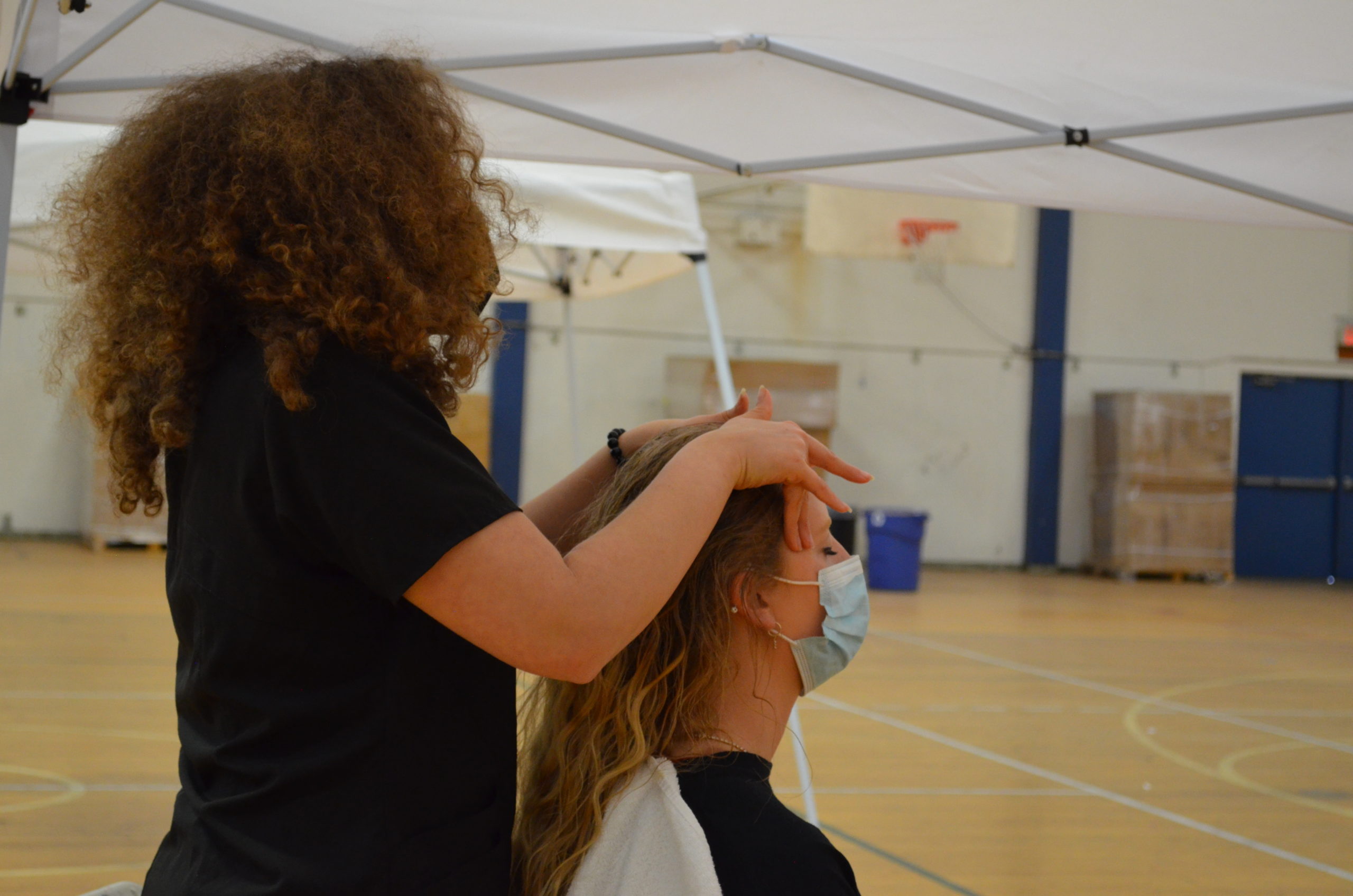 A photo of a patient receiving treatment at the SCU Health Tent Event