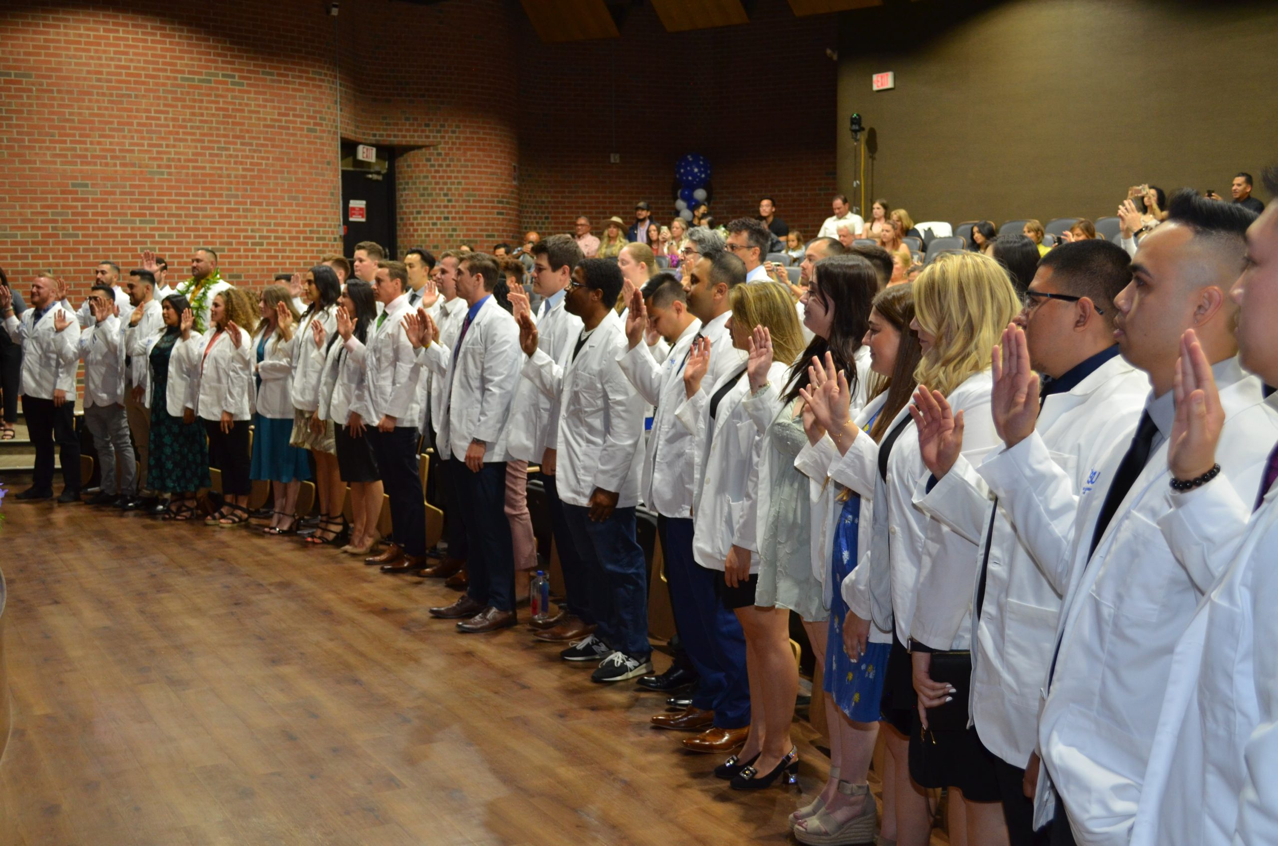 DC Students recite the Clinical Clerkship Oath during their White Coat Ceremony