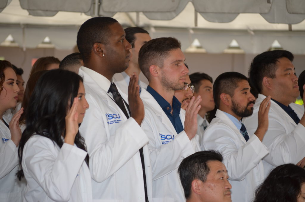 SCU students recite the Clinical Clerkship Oath during the SCU Fall 2022 White Coat Ceremony