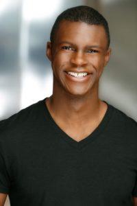 A headshot of Quintin Howze