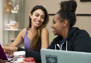SCU students Martha Makonen and Angelica Ortiz studying