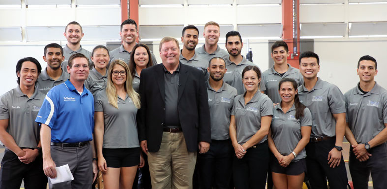 Group of SCU Chiropractic Sports Medicine students standing with Dr. Bill Moreau
